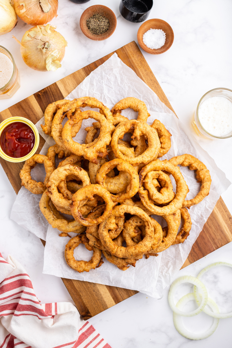 onion rings displayed with a container of ketchup