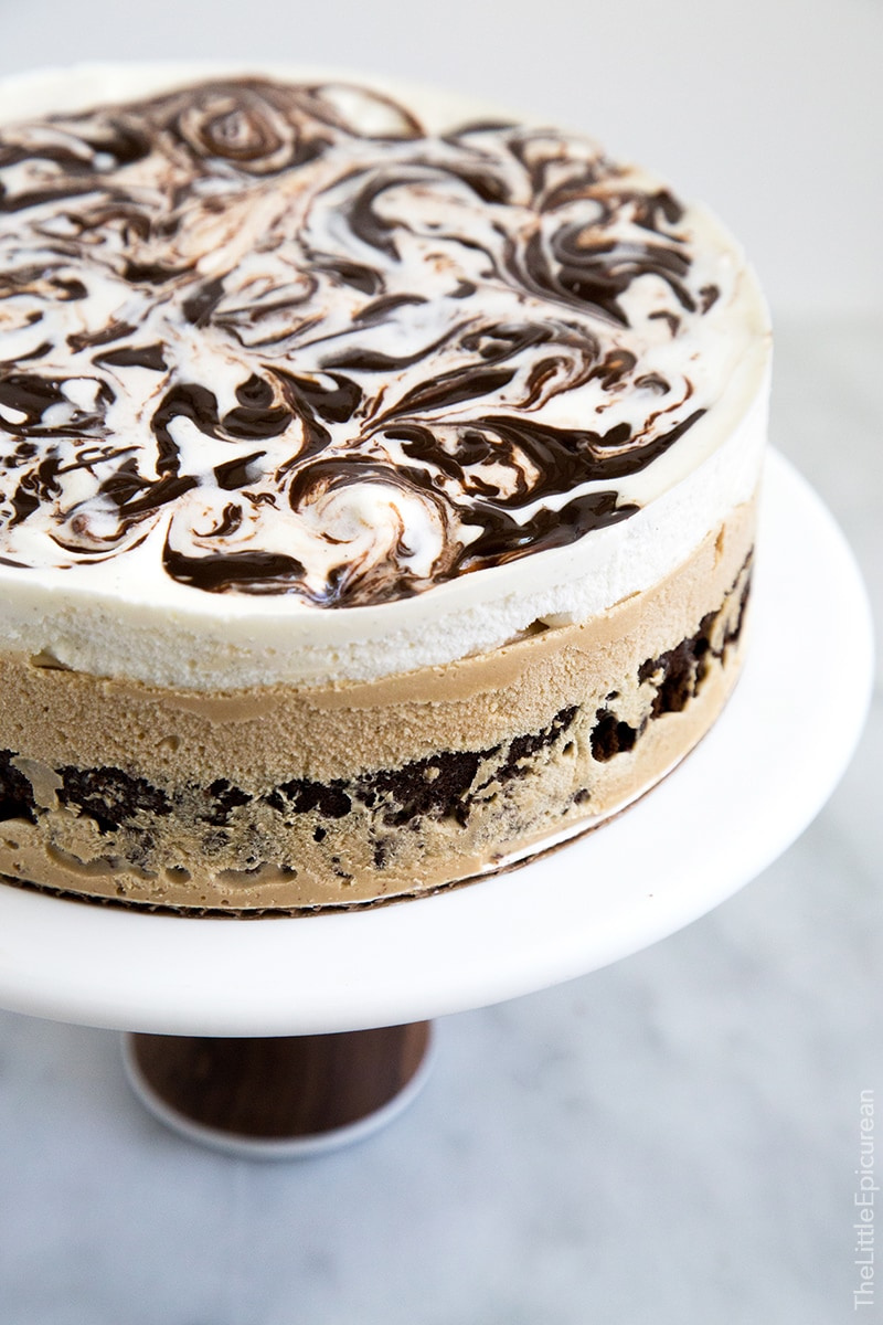 coffee ice cream cake on a white cake stand