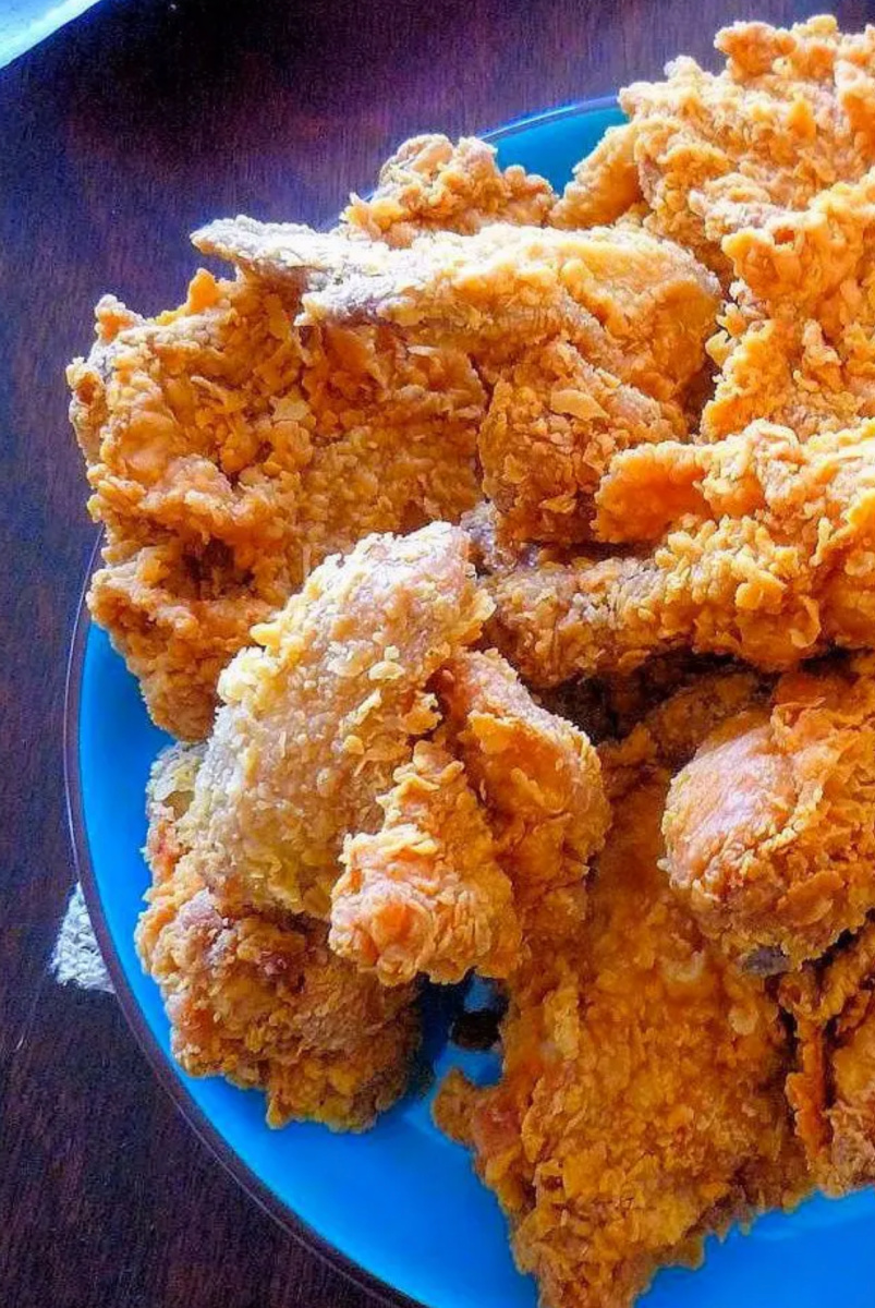 copycat popeyes spicy fried chicken on blue plate
