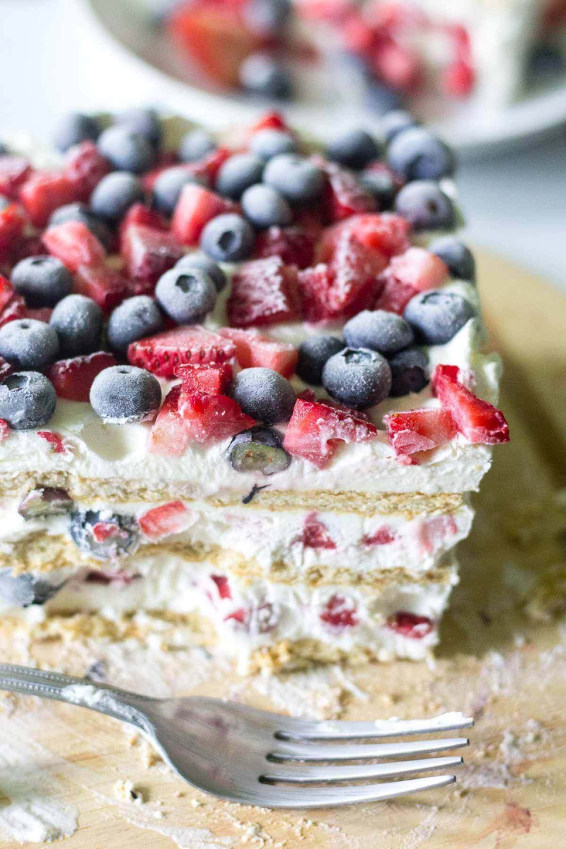 red white and blue icebox cake slice with fork