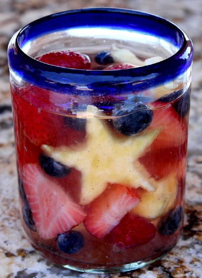 glass of red white and blue sangria