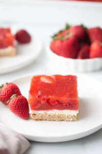 slice of strawberry pretzel salad on white plate