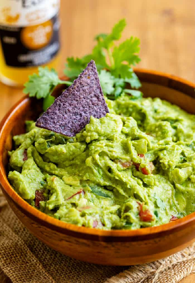 guacamole in wood bowl