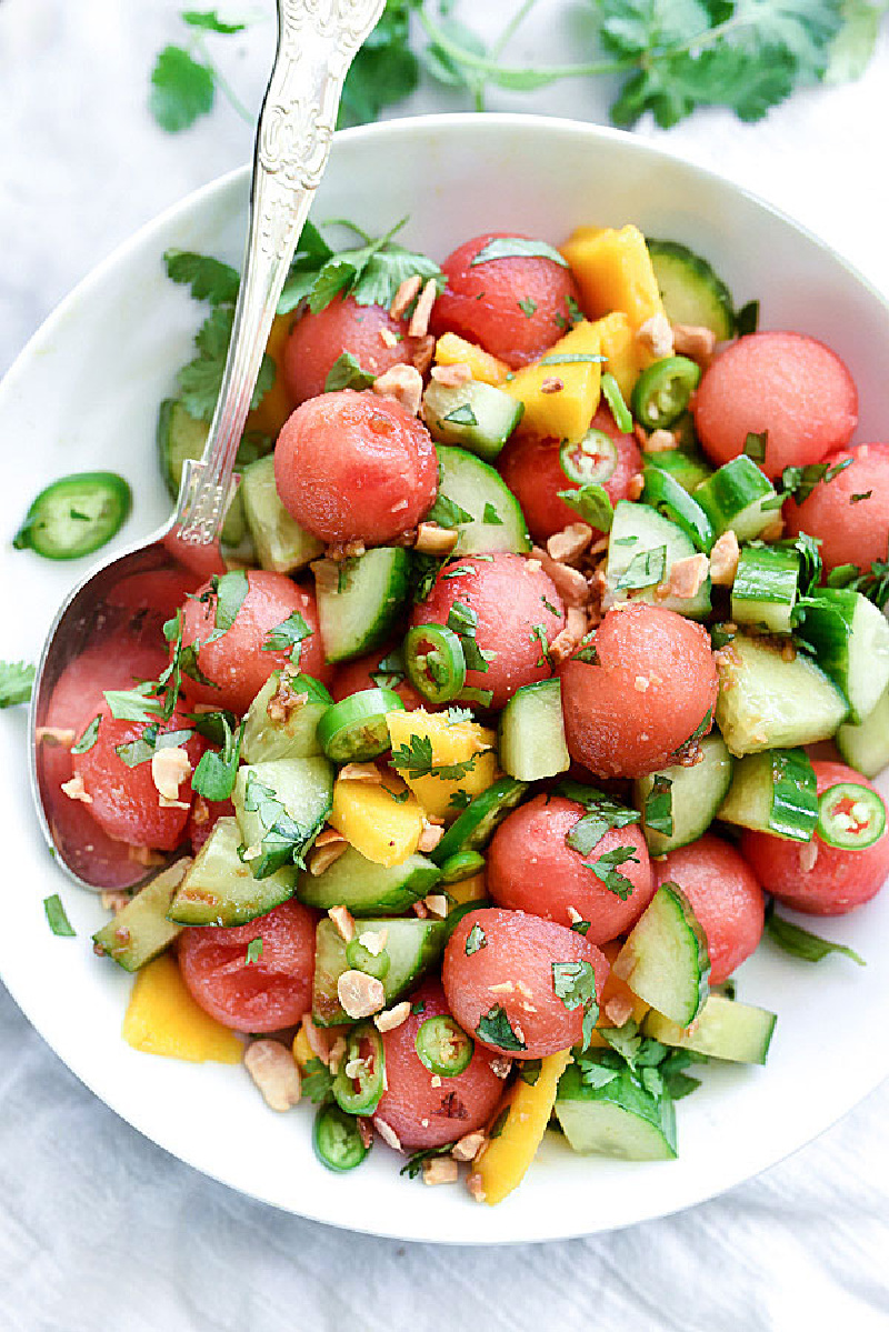 white bowl with cucumber basil and watermelon salad