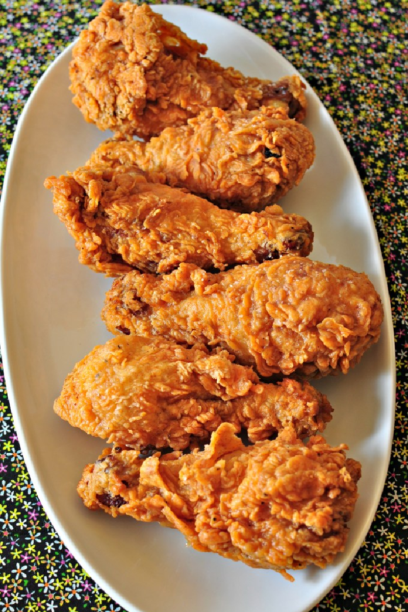 extra crispy spicy fried chicken on a white plate