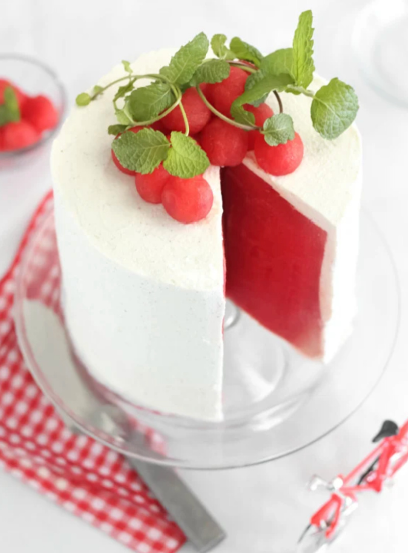 watermelon cake with a slice out of it