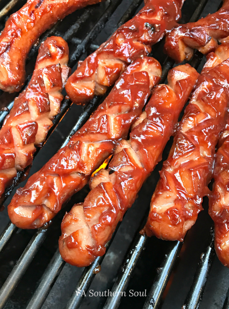 grilled barbecued hot dogs on the grill