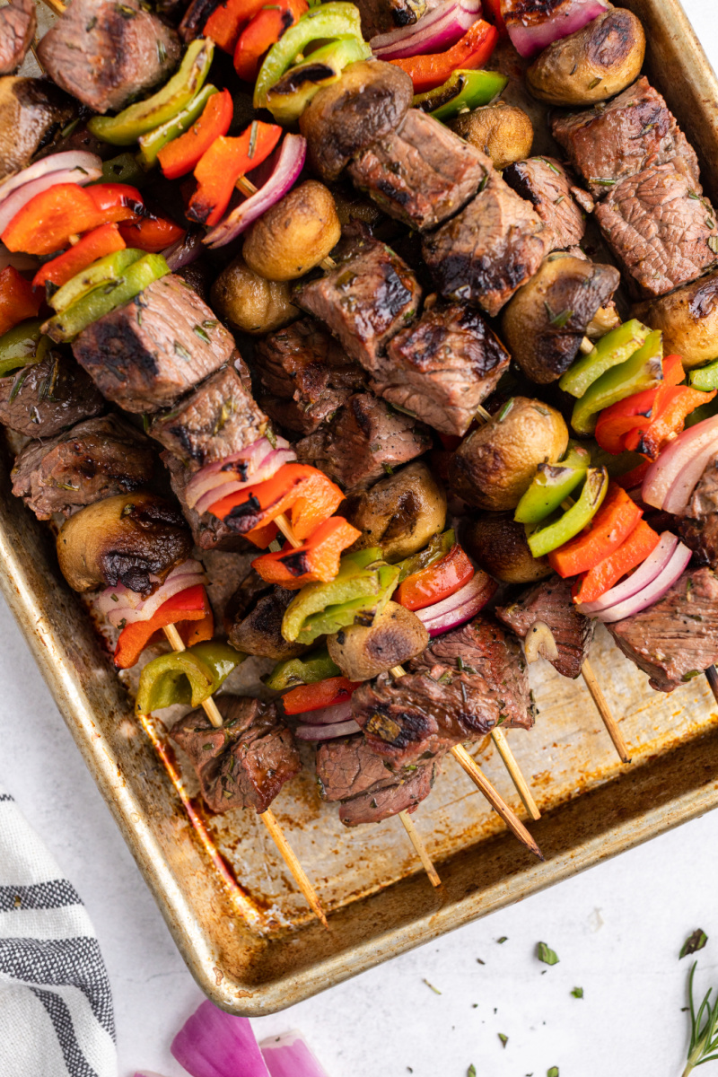 grilled lemon garlic steak kebabs on a baking sheet