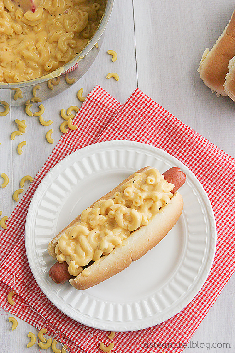 mac and cheese dog on a white plate