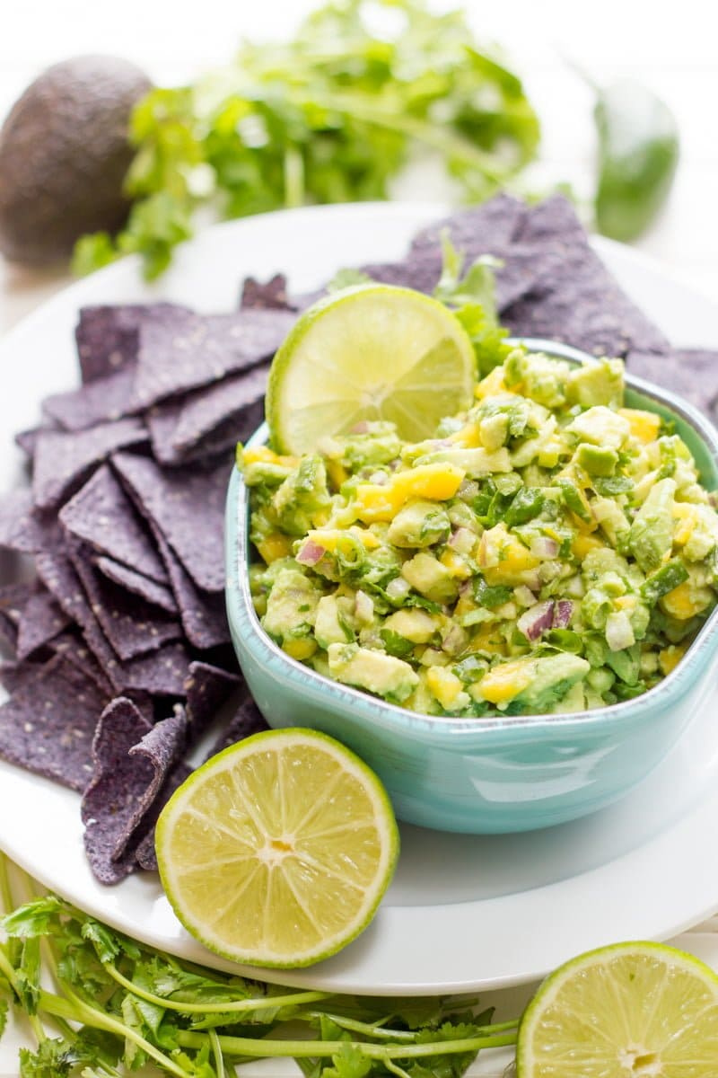 mango guacamole in a blue bowl