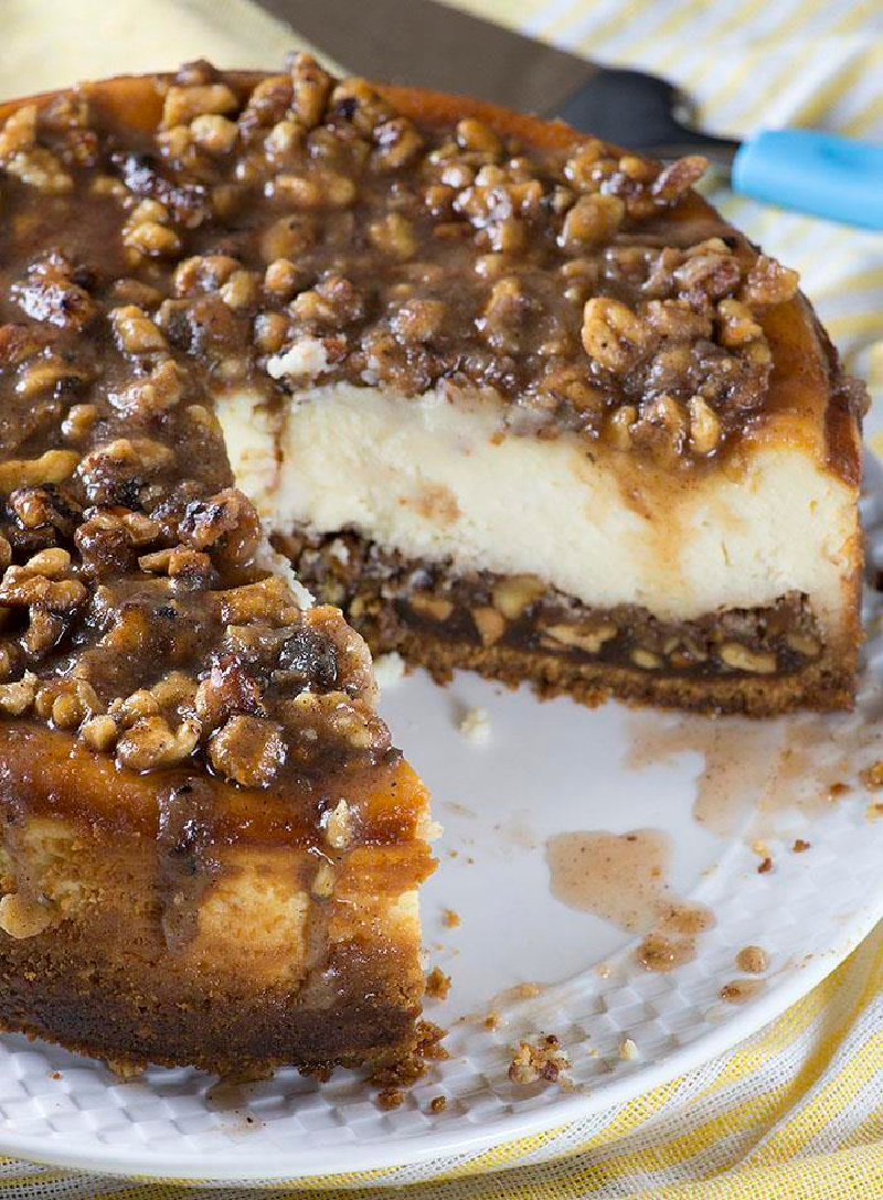 pecan pie cheesecake with big slice taken out