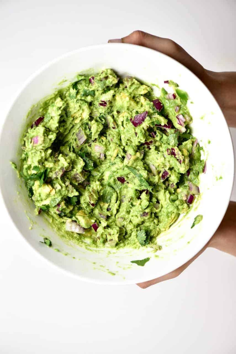 authentic guacamole in a white bowl