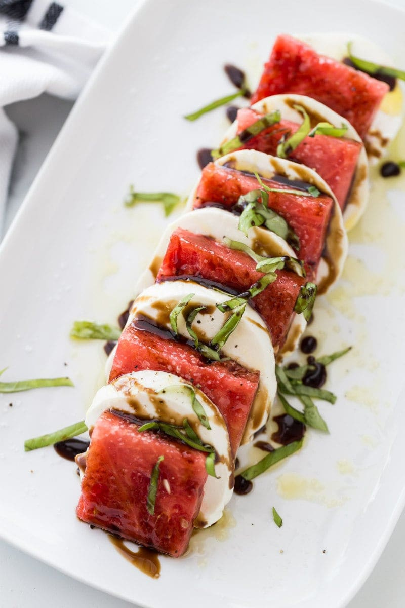 watermelon caprese salad on white plate