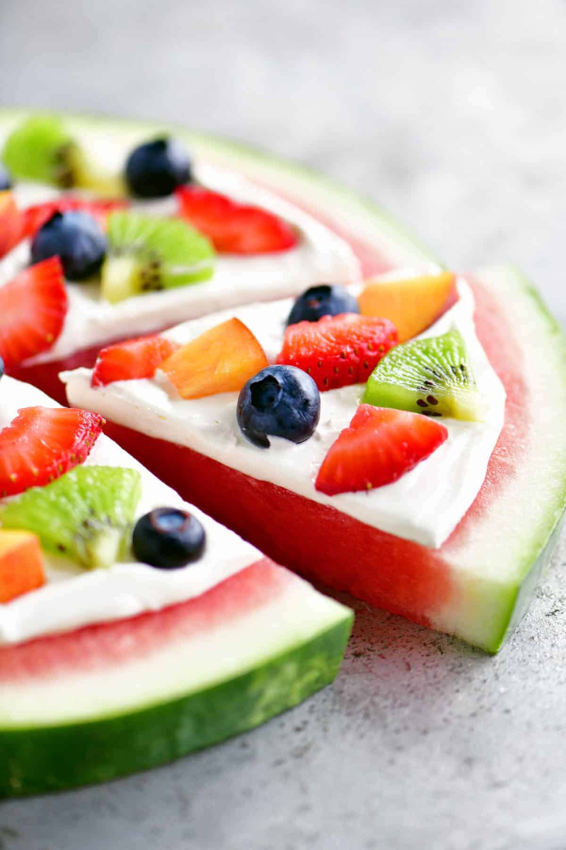 watermelon pizza with slice taken out of it