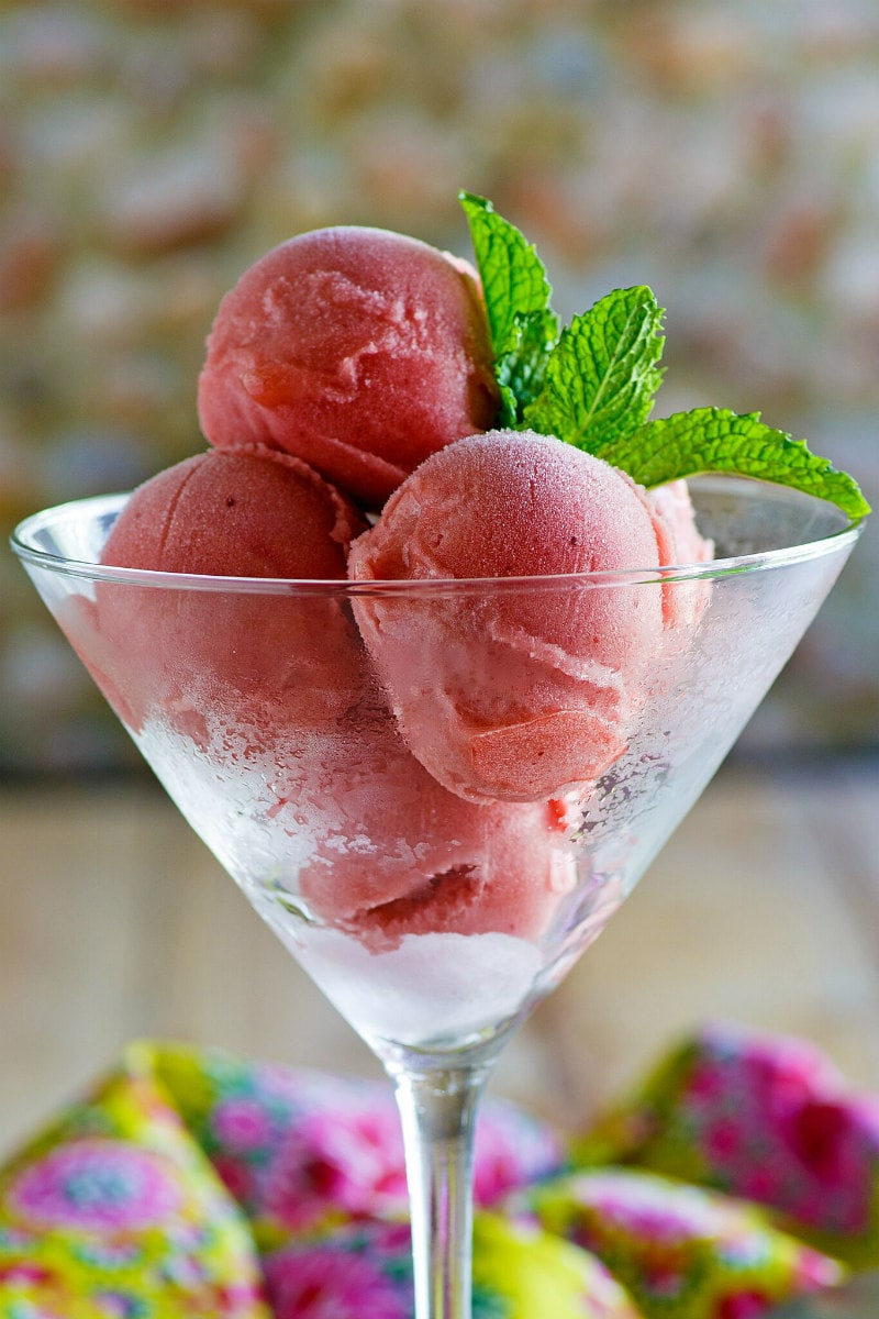 scoops of watermelon sorbet in a martini glass