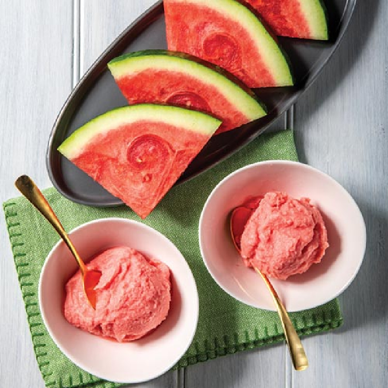 bowls of watermelon whip with fresh watermelon on plate