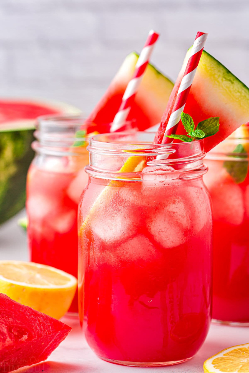 jars of watermelon lemonade with straws