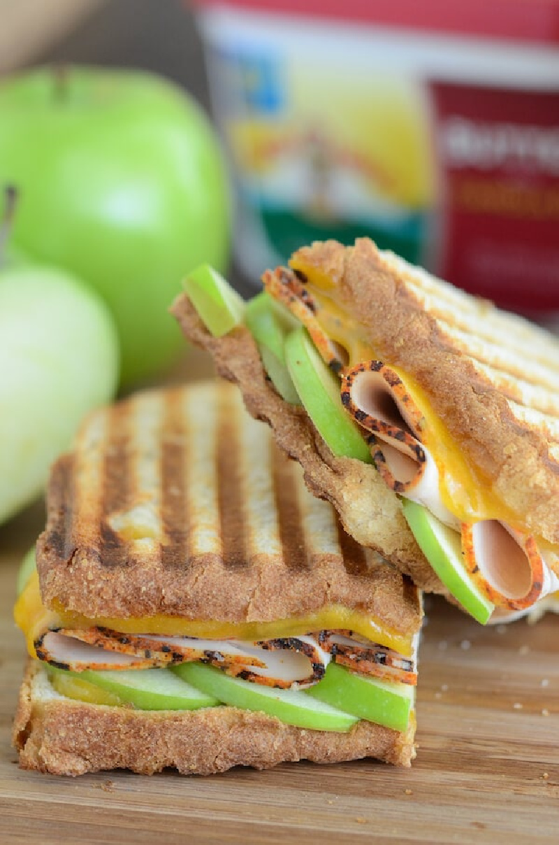 two slices apple cheddar turkey panini