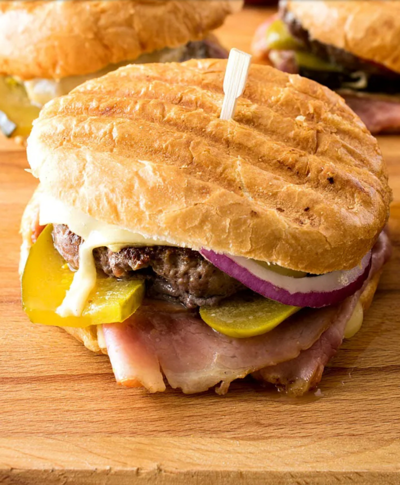 cuban panini burger on cutting board