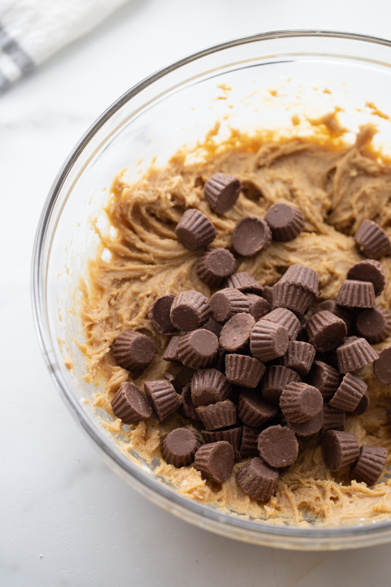 dough with added peanut butter cups in bowl