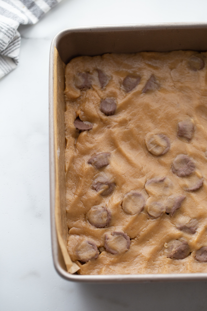 peanut butter cookie dough pressed into pan