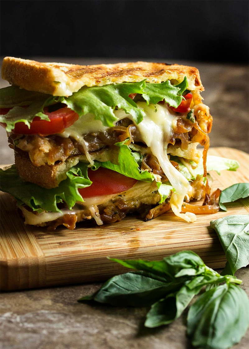 italian chicken pesto panini on cutting board