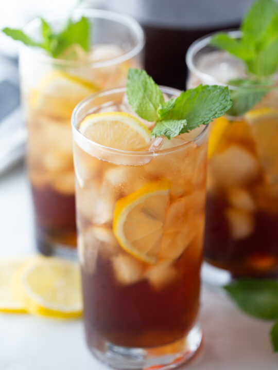 tall glass of southern sweet tea garnished with mint