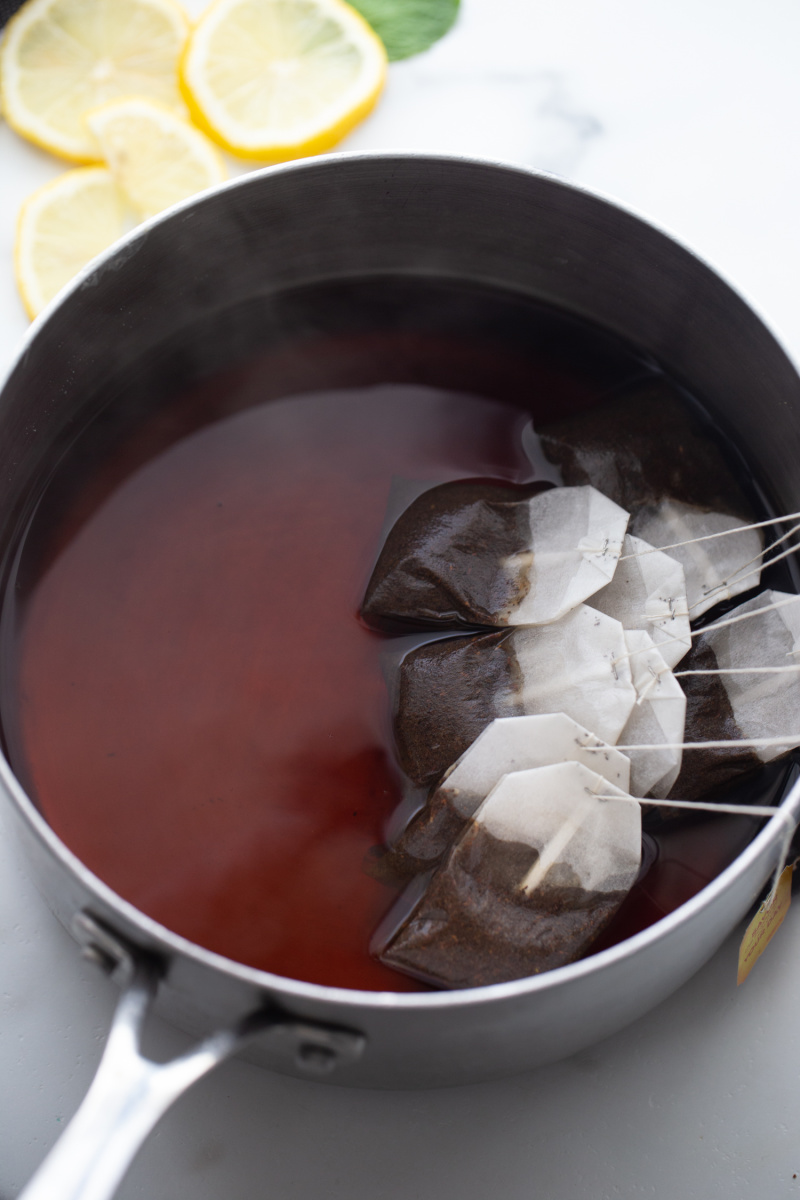 pan with water and tea bags in it