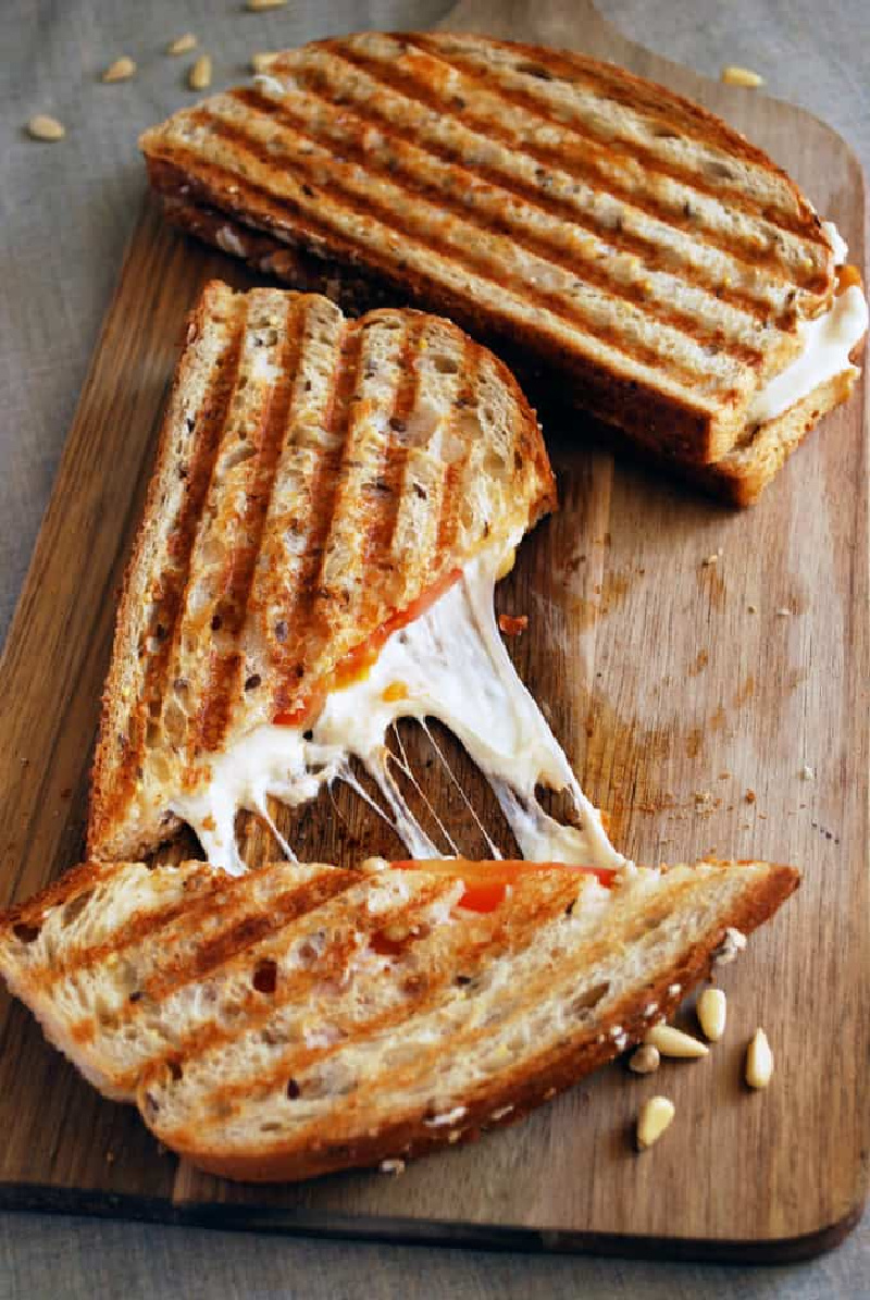 sundried tomato pesto panini pulled apart cheese showing