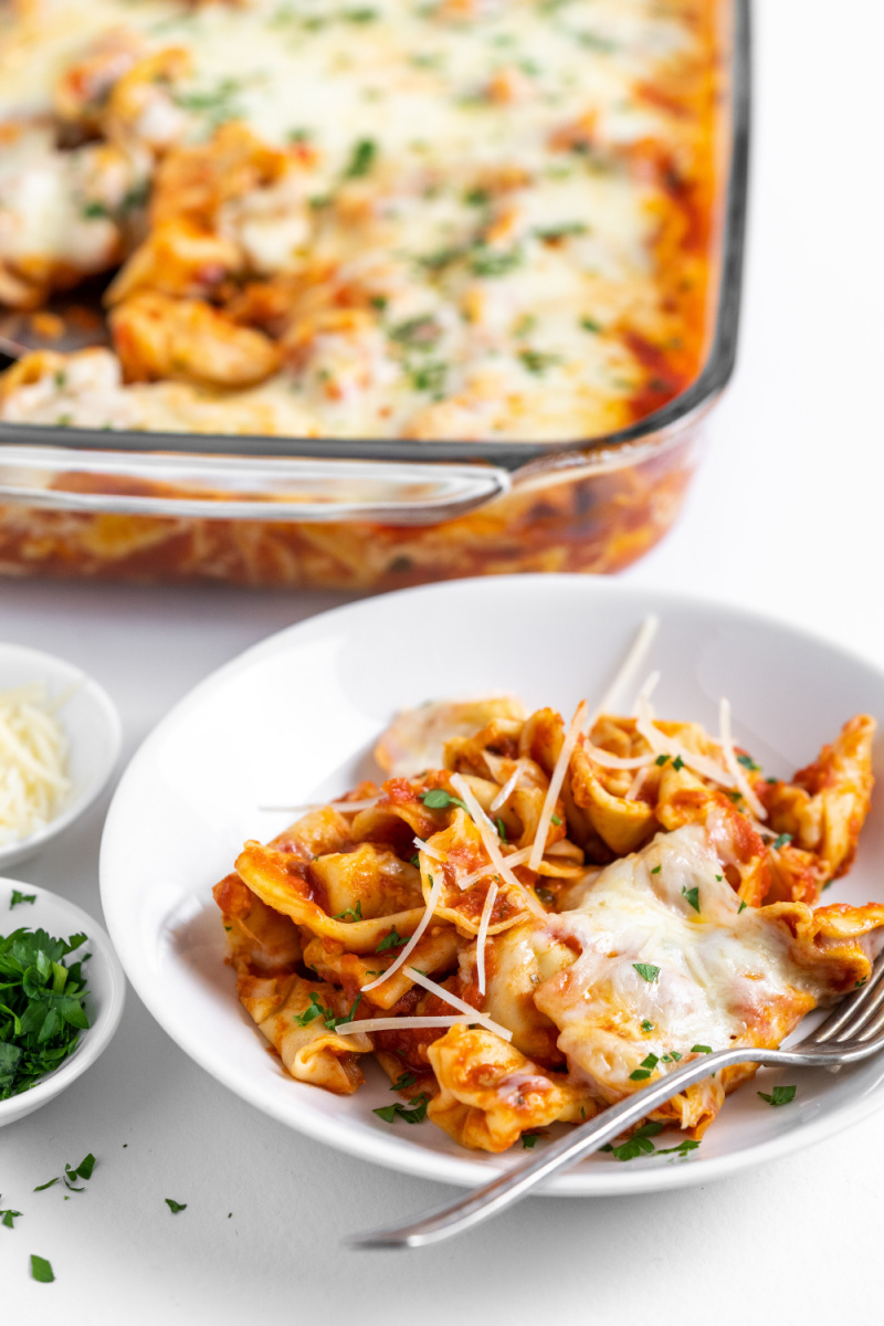 serving of baked tortellini casserole in dish