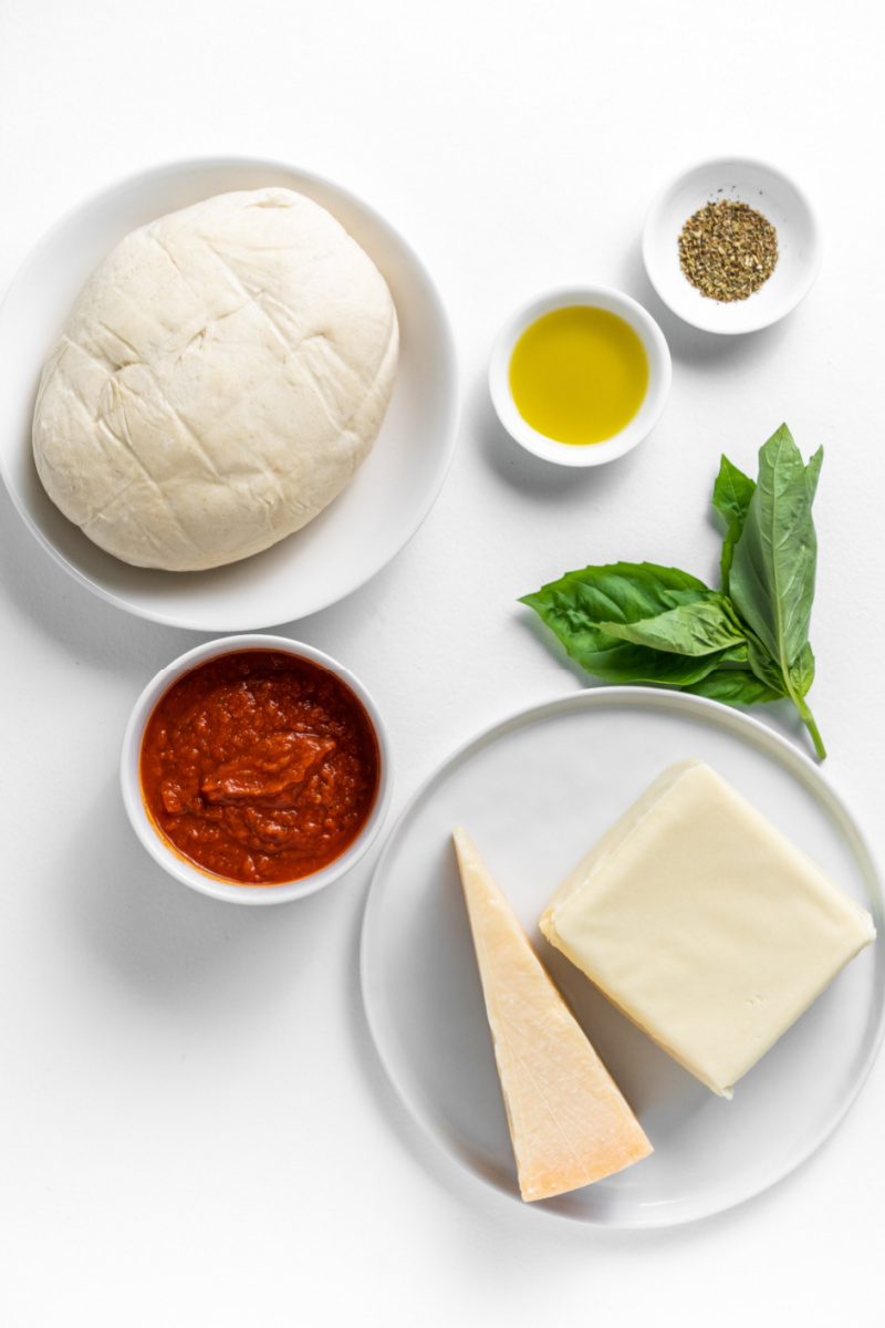 ingredients displayed for making classic cheese pizza