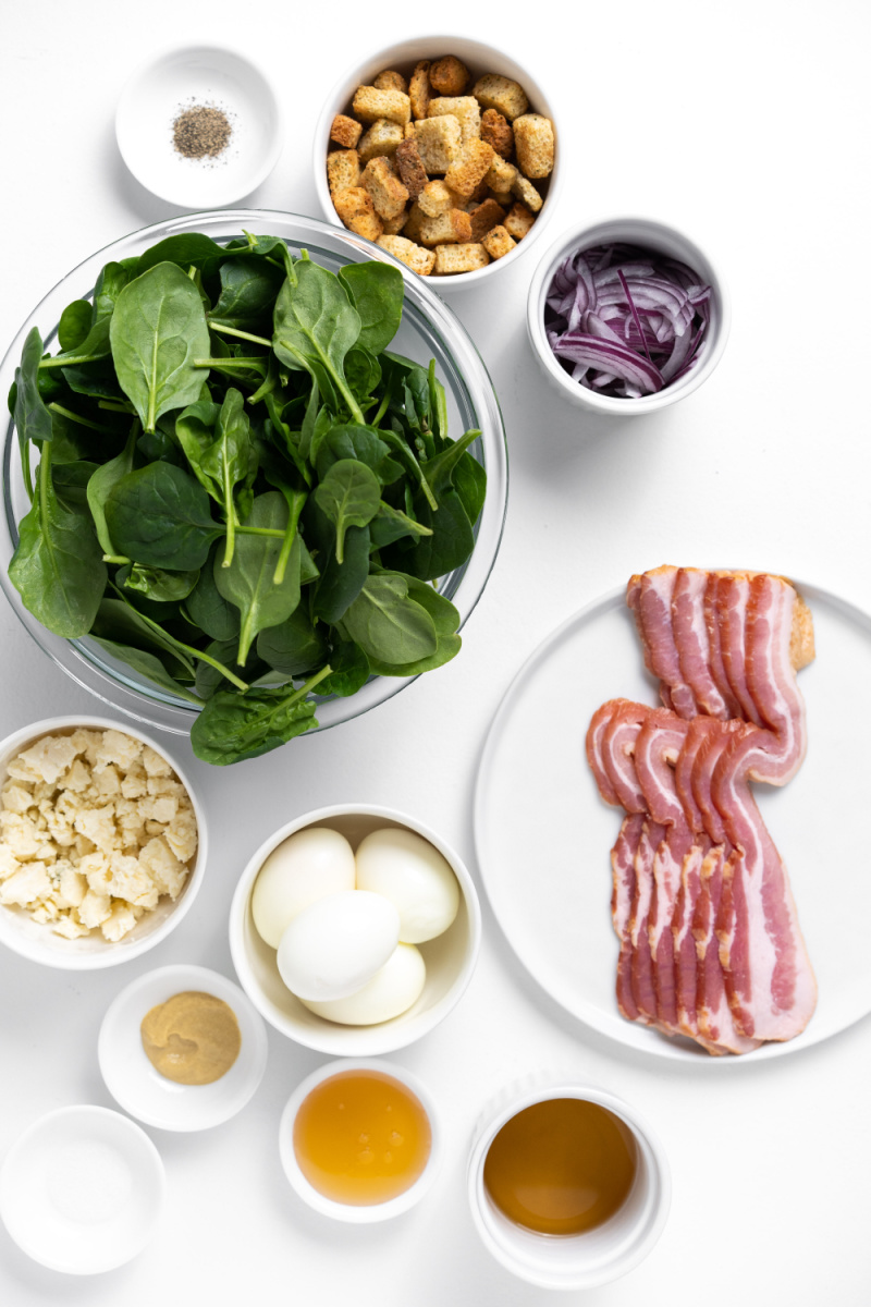 ingredients displayed for making classic spinach salad