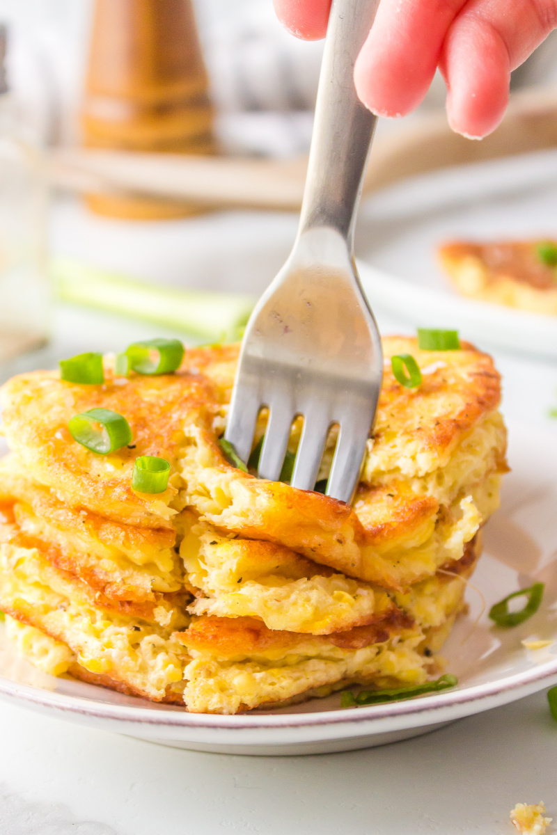 fork poking corn fritters