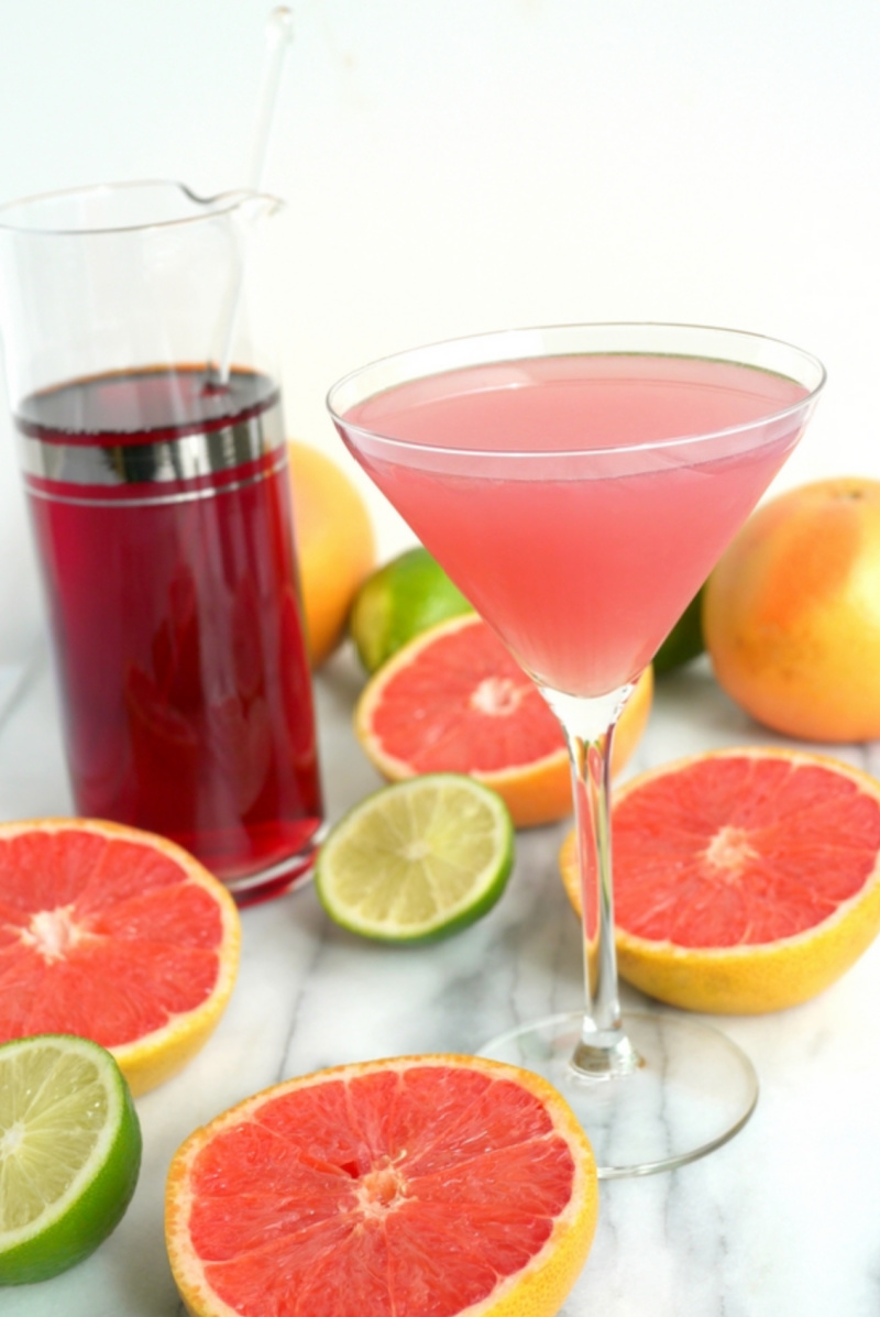 grapefruit cranberry martini with grapefruit and lime halves