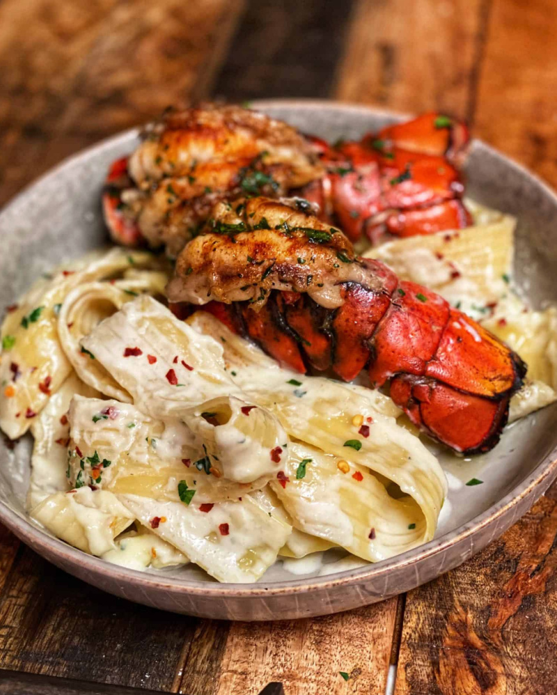 grilled lobster tail pasta in a bowl