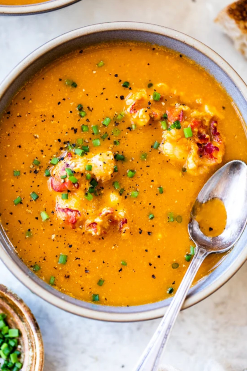 lobster bisque in bowl with spoon