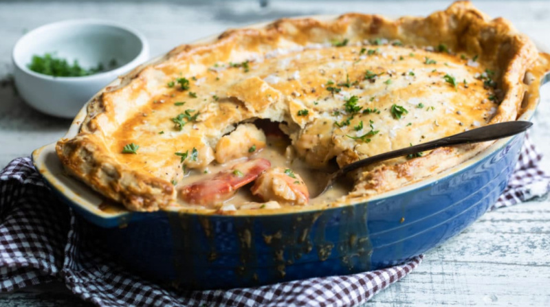 main lobster pot pie in a blue baking dish