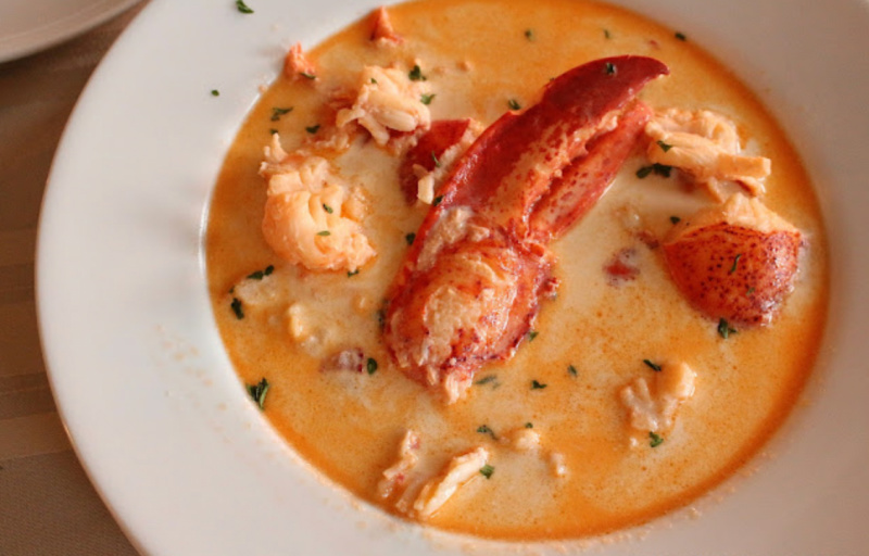maine lobster stew in a white bowl