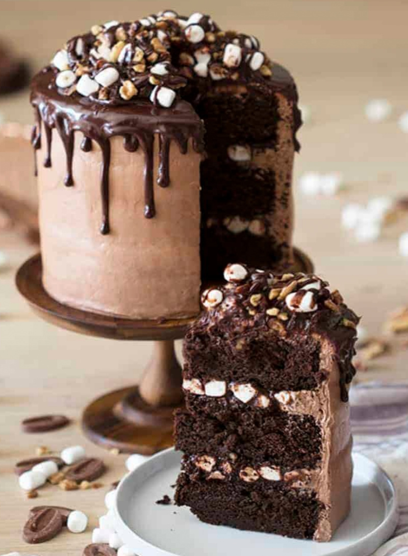 rocky road layer cake with slice on plate