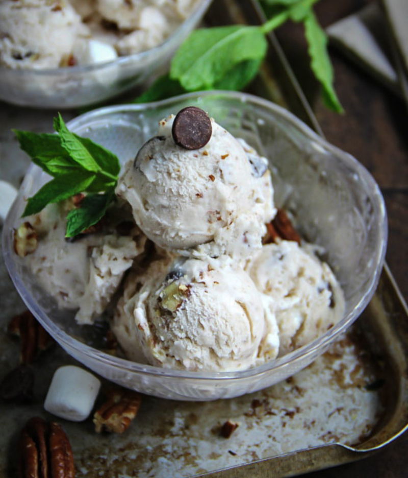scoops of vanilla rocky road ice cream in a dish