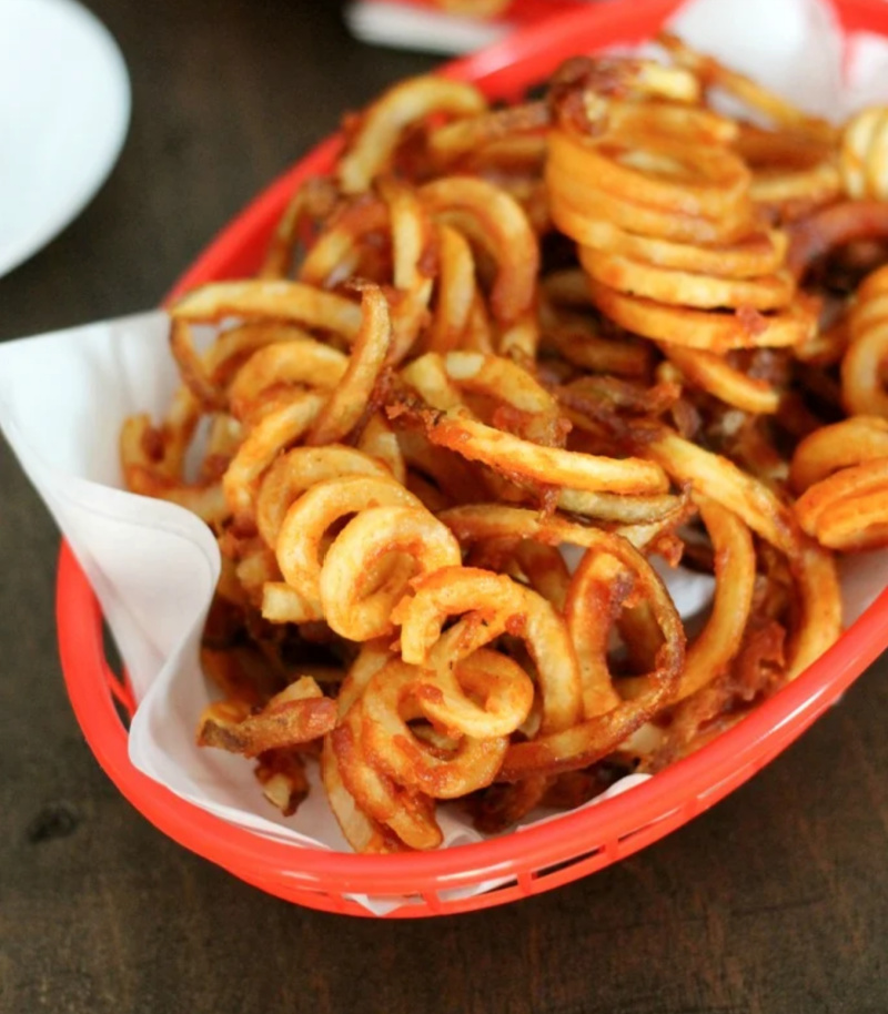 red basket of curly fries