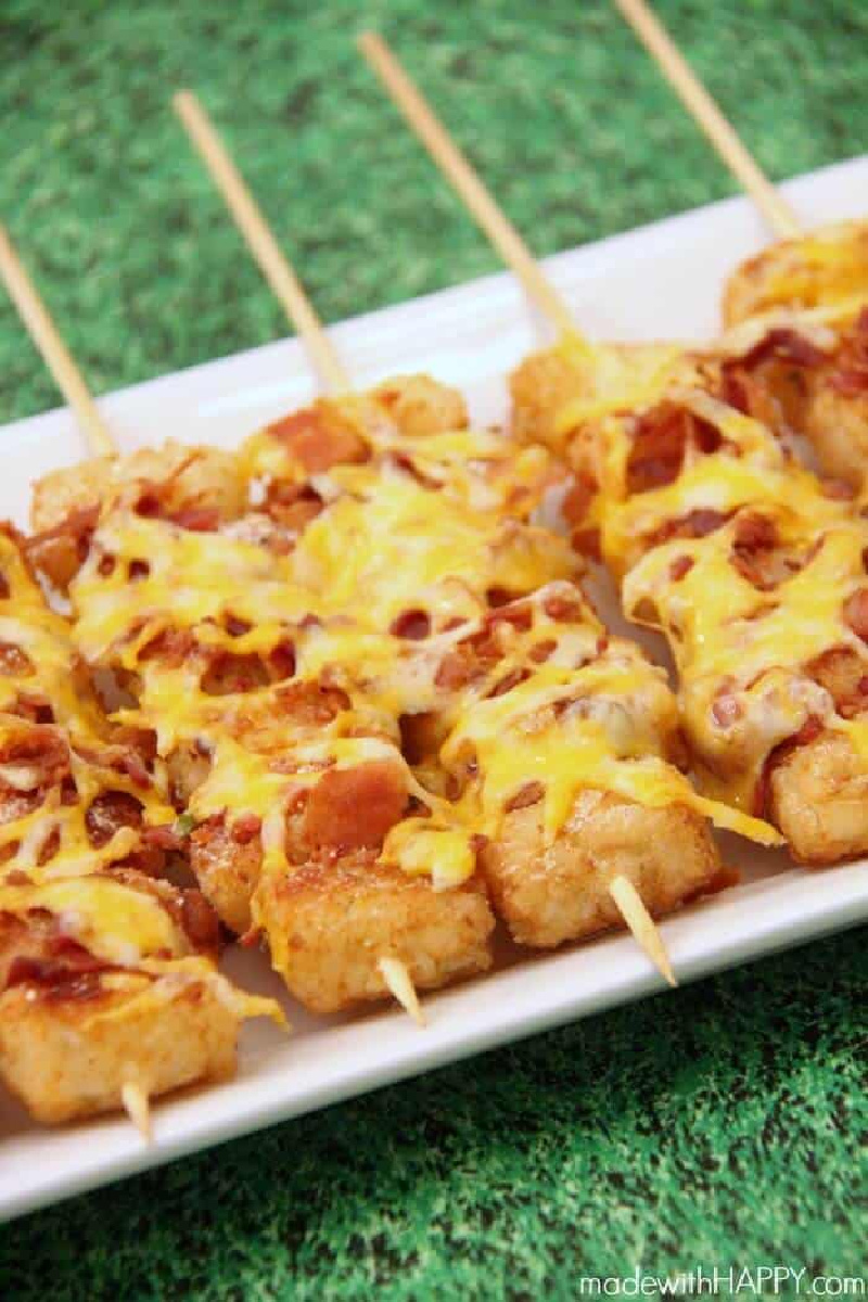 Loaded Tater Tot Skewers on a platter