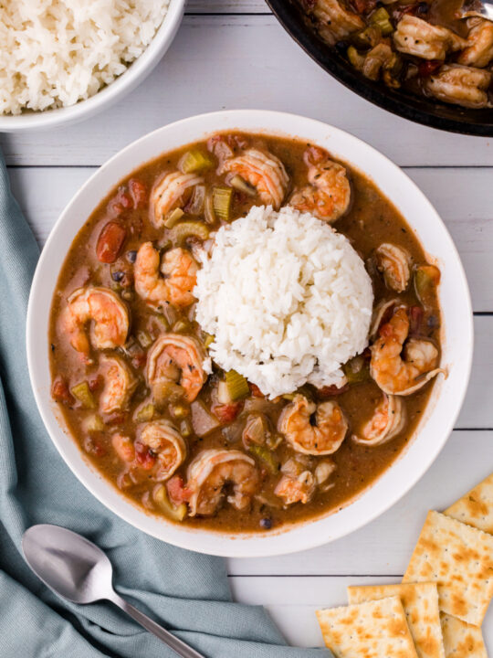 shrimp gumbo in a bowl topped with rice