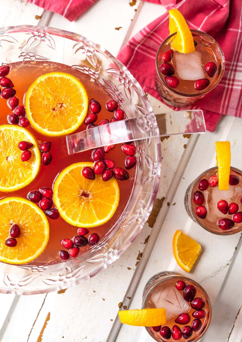 bowl of cranberry orange holiday punch with glasses of punch