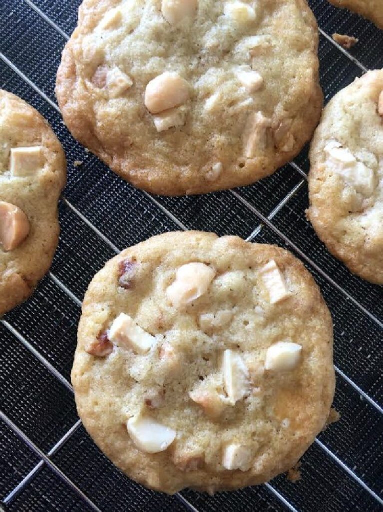 white chocolate macadamia nut cookies on a baking rack