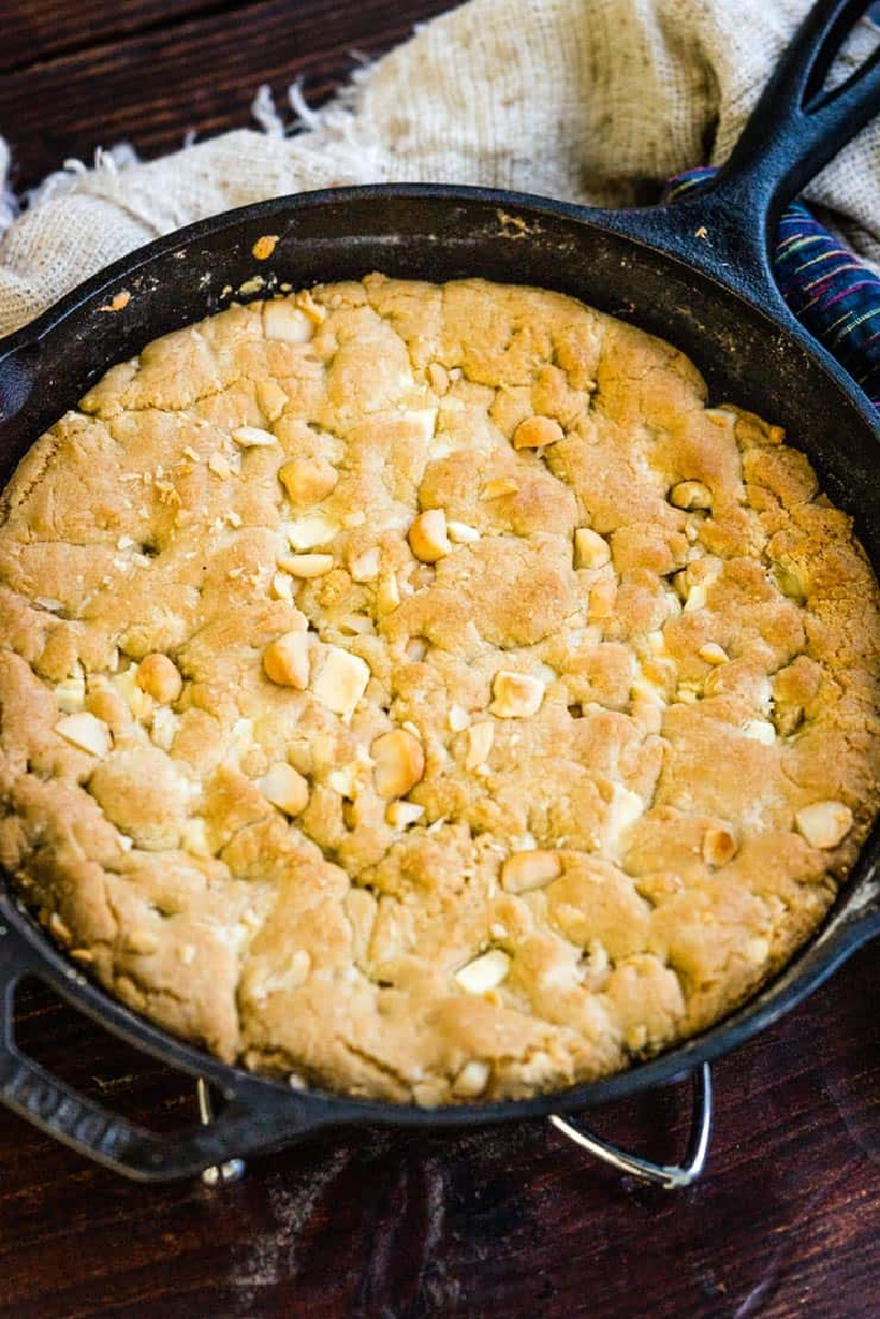 white chocolate macadamia nut pizookie in a black skillet