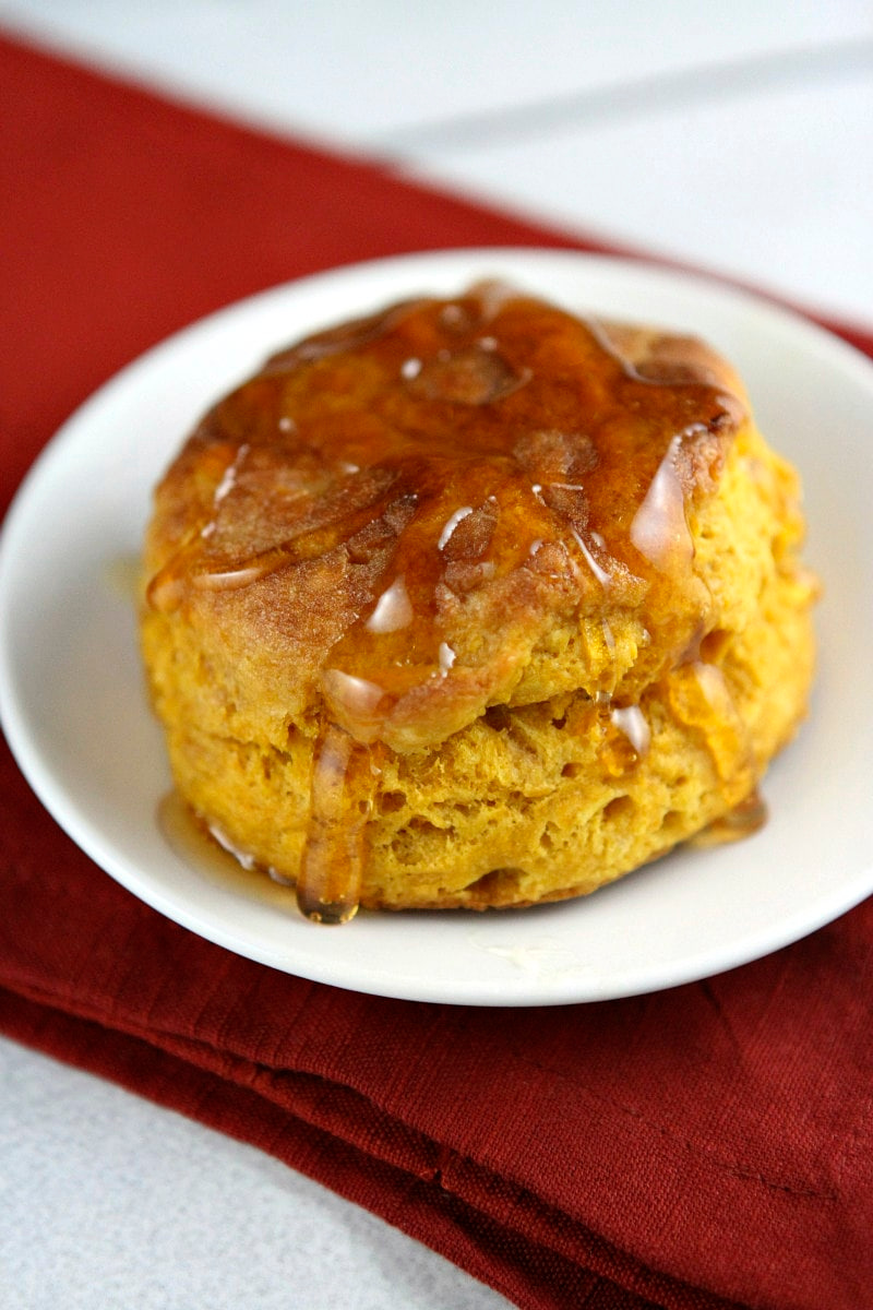 pumpkin biscuit covered with honey on a plate