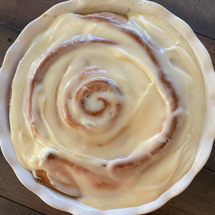 giant cinnamon roll with frosting