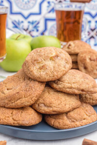 apple cider snickerdoodles stacked on a platter