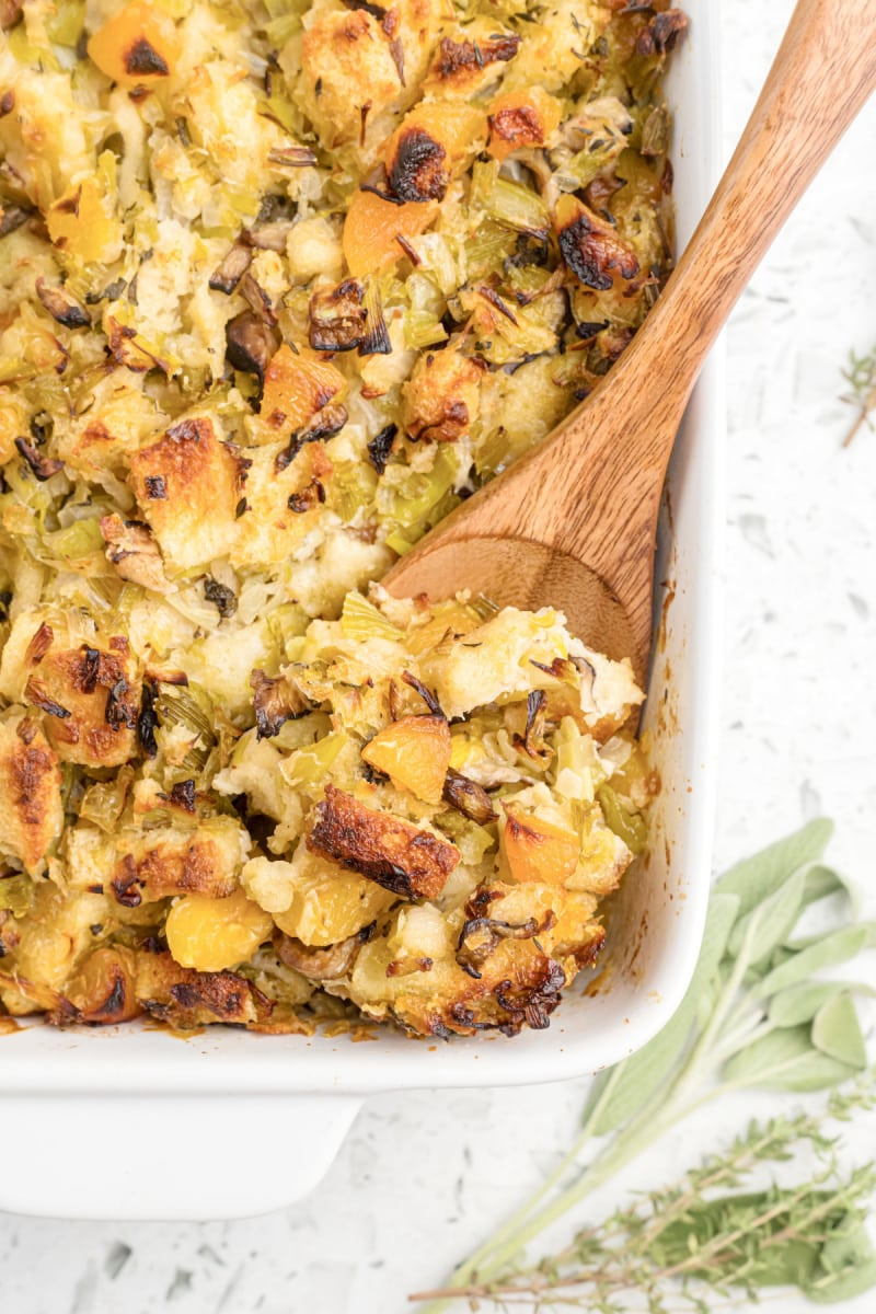 pan of stuffing with wooden spoon